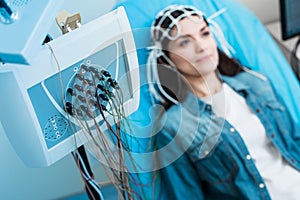 Close up of electroencephalograph recording brain waves of woman