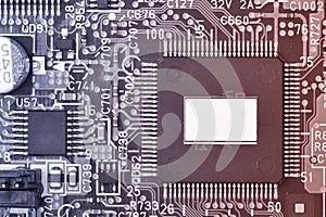 Close-up of electronic circuit board with processor Toned image