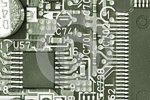 Close-up of electronic circuit board with processor Toned image