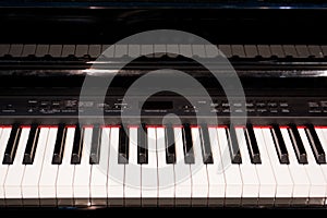 Close up of electronic piano keys close frontal view