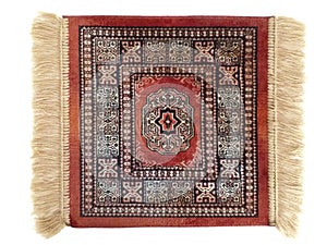 Elegant small red persian rug with fringe isolated on white background