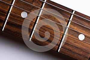 Close-up elements of electric guitar on gray background