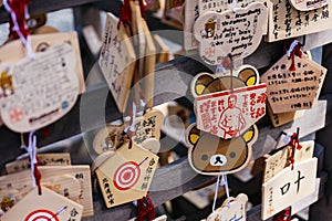 Close up Ema are small wooden plaques, common to Japan, in which Shinto and Buddhist worshippers write prayers or wishes.