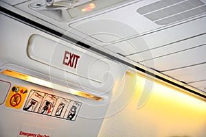 Close up of emergency door exit sign in the aircraft