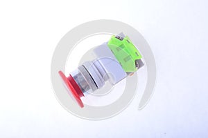 Close-up emergency stop button on white background.