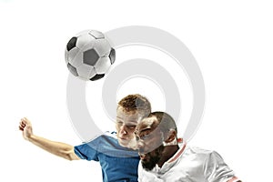 Close up of emotional men playing soccer hitting the ball with the head on isolated on white background