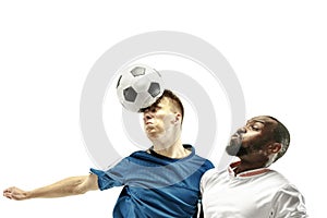 Close up of emotional men playing soccer hitting the ball with the head on isolated on white background