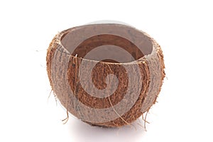 Close-up of empty coconut shell bowl over white background