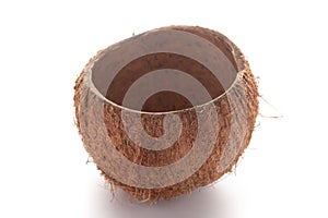 Close-up of empty coconut shell bowl over white background