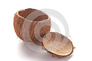 Close-up of empty coconut shell bowl over white background