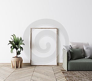 Close up for Empty frame poster interior design in modern living room mock-up ,White background. green couch. Scandinavian style