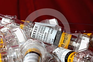 Close up empty glass syringes with re-use prevention feature - covered with plastic case. 5