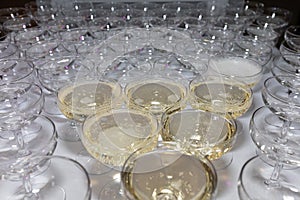 Close-up of empty glasses of champagne or wine are on the table at the ceremony