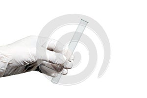 Close-up. Empty medical or laboratory test tube in the left male hand. White rubber glove. Isolated background.