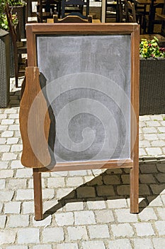 Close up of empty menu board on street