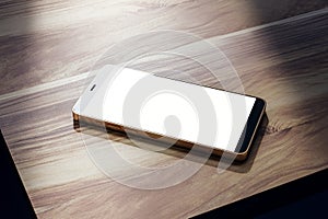 Close up of empty mobile phone on wooden table. Mock up, 3D Rendering