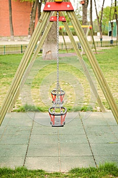 Close up of empty swing in a children play area at park