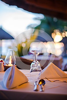 Close-up empty wine glass on the set table at