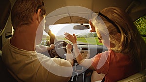 CLOSE UP: Energetic couple having fun during their road trip through countryside