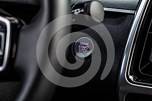 Close up engine car start stop button.