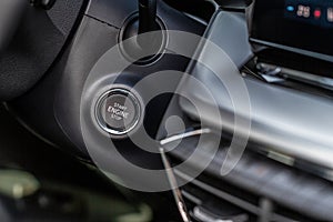 Close up engine car start stop button.