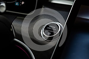 Close up engine car start stop button. Modern car interior details