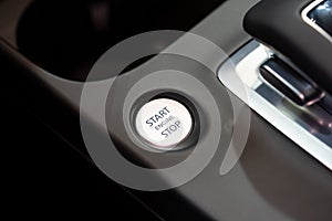 Close up of engine start stop button in car