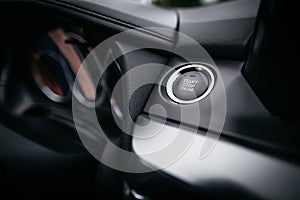 Close up Engine start stop button from a modern car interior