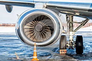 Close-up of engine of white passenger airplane