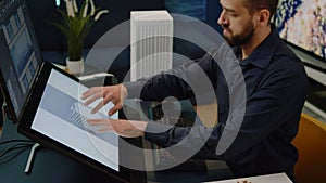 Close up of engineer using computer for building model