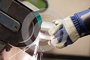 Close Up Of Engineer Using Grinding Machine In Factory