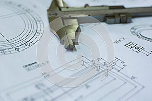 Close-up engineering drawing and caliper. Concept technical background