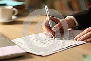 Entrepreneur hands filling form checking yes at night photo