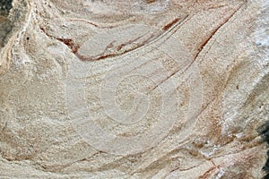 Close up of eroded rock strata with space for copy