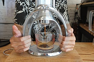 Close-up of espresso pouring from coffee machine