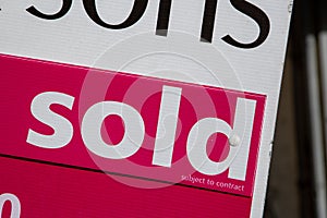 a close up of an estate agent or realtors sold sign
