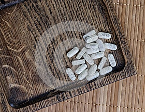 Close-up of ester-c tablets on a wooden background.  biologically active supplements topview photo