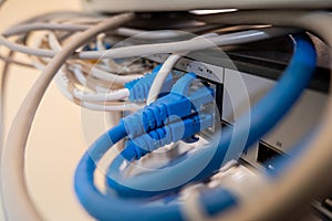 Close-up of Ethernet cable pluged on network switch, UTP cabling and computer network