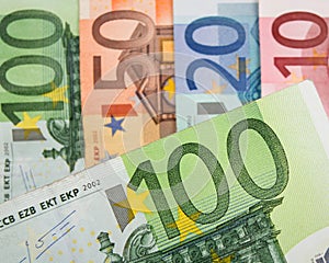 Close up of Euro banknotes with 100 Euros in focus