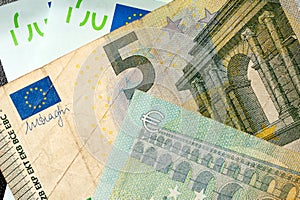 Close-up euro bills lie next to each other