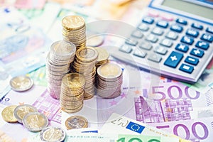 Close-up euro coins and banknotes with calculator