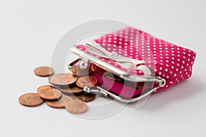 Close up of euro coins and wallet on table