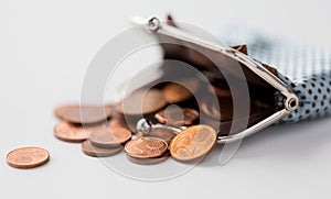 Close up of euro coins and wallet on table