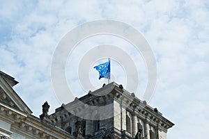 Close-up of European flag on famous Reichstag building, seat of