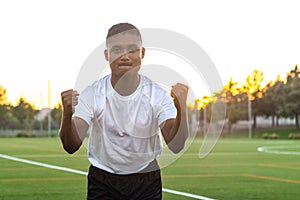 Close up of excited soccer player celebrating a goal.