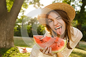 Close up of excited young girl in summer hat