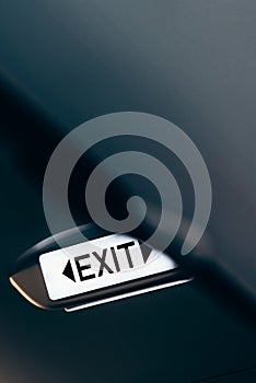 Close up of exit sign in passenger airplane