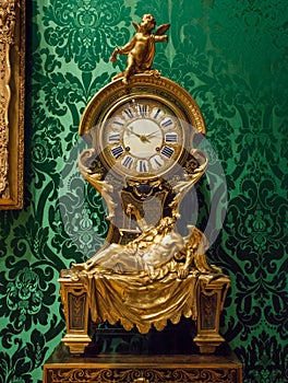 Close up of exquisite French 18th Century clock with ornate background