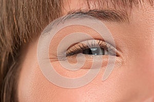 The close up eye on face of young beautiful caucasian girl