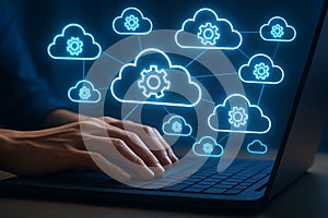 Person typing on laptop with cloud network graphic